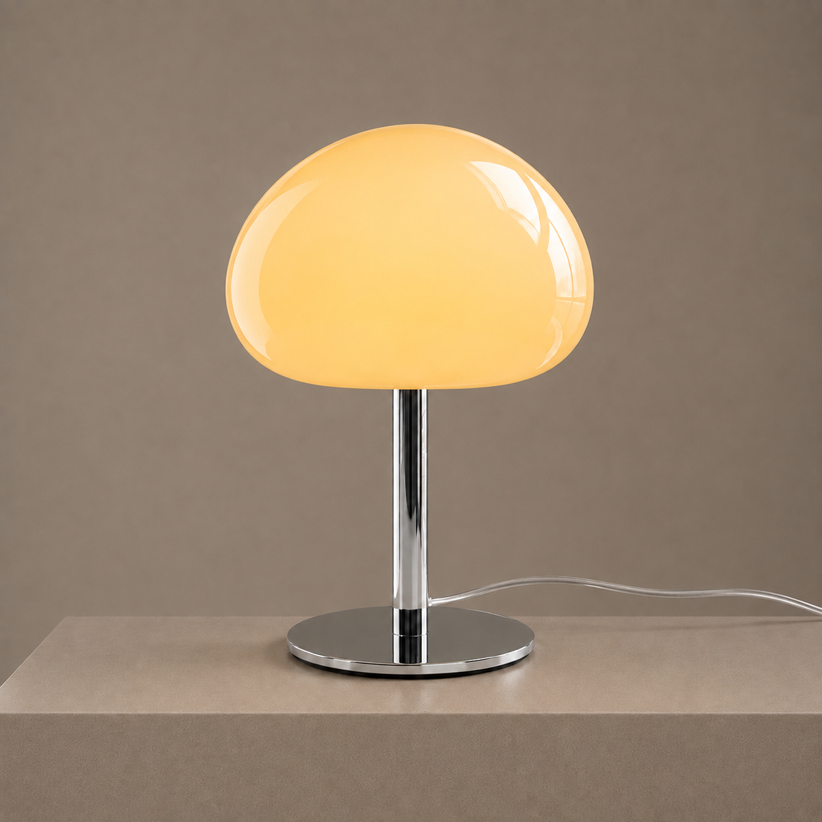 Illuminated cream glass mushroom lamp casting a soft warm glow on a neutral pedestal.